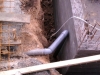 Sewage pipe in place at the top of the retaining wall